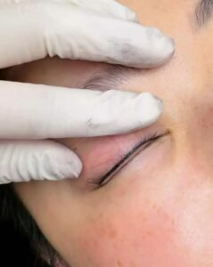 Lash line enhancement eyeliner tattoo with closed eyes at Sunny Brow Los Angeles