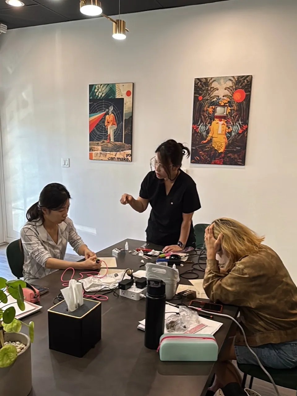 Small-group permanent makeup class with an instructor at SUNNYBROW Academy, a PMU school in Koreatown, Los Angeles